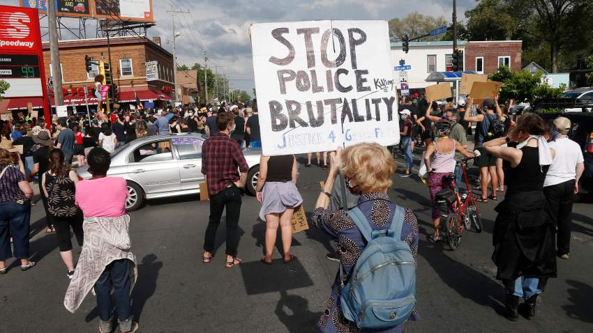 Hundreds of protesters gather Tuesday, May 26, 2020 near the site of the arrest of George Floyd who died in police custody Monday night in Minneapolis after video shared online by a bystander showed a white officer kneeling on his neck during his arrest as he pleaded that he couldn't breathe. (AP Photo/Jim Mone)